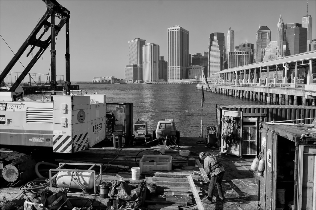 New York City Street Photography - Workers in front of Skyline b&w
